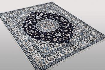 A carpet, Nain, part silk, ca 256 x 199 cm.