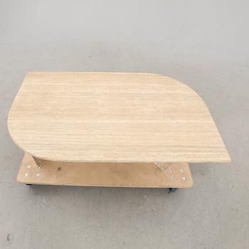 A 21st century travertine coffee table.