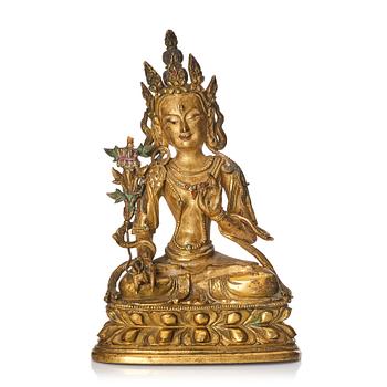 910. A Tibeto-Chinese/Mongolian gilt bronze figure of White Tara, 18th Century.