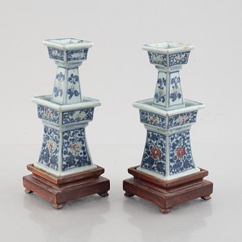 A pair of Chinese porcelain altar sticks, late Qing dynasty.