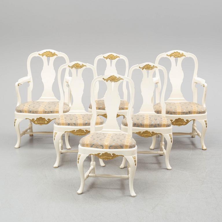 A dining table and six chairs, rococo style, mid 20th century.
