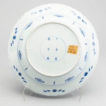 A large blue and white deep dish, Qing dynasty, with Kangxi six character mark and period (1662-1722).