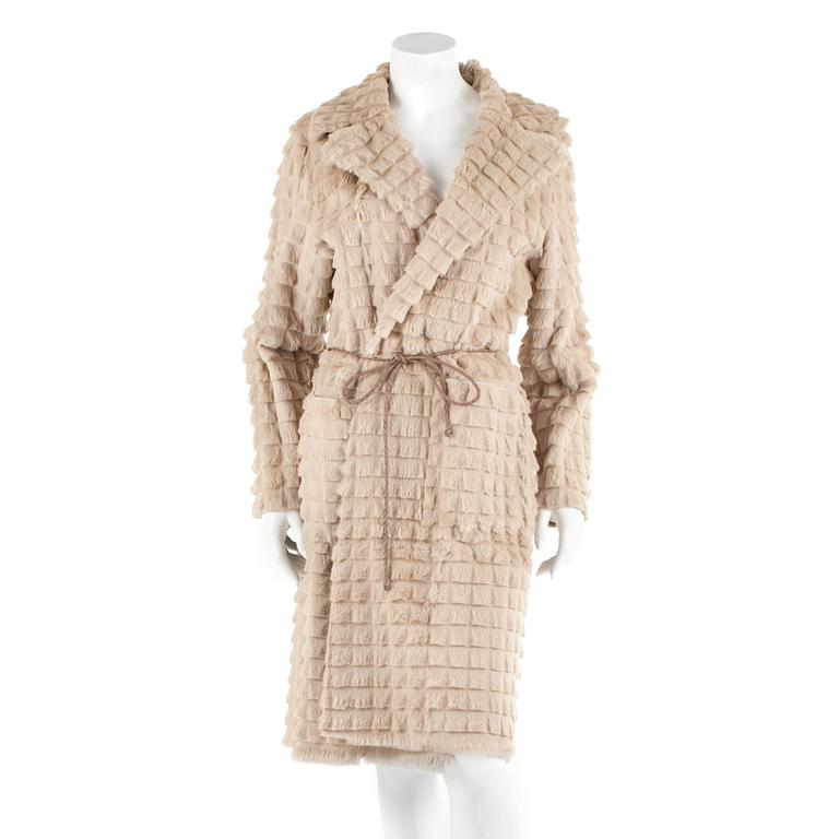 BROR AXEL PETERSEN, a beige rabbitfur coat. Size M.