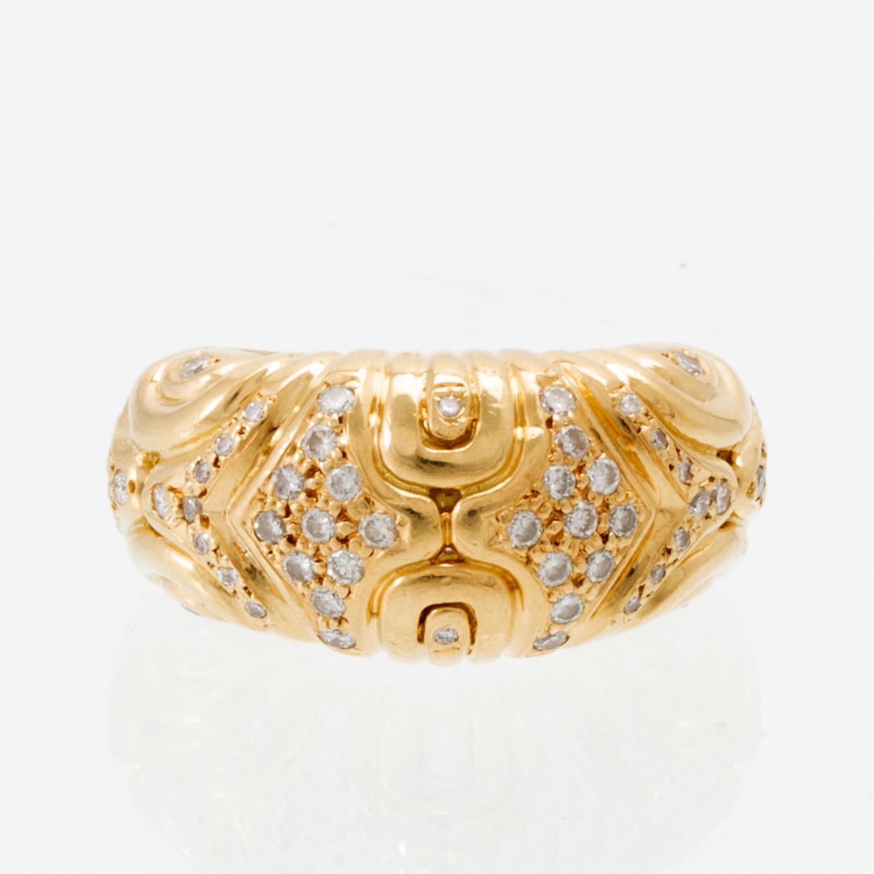 An 18K gold ring set with round brilliant-cut diamonds, London.