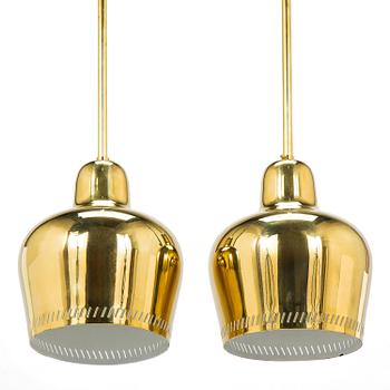 Paavo Tynell, a pair of mid 20th century ceiling lights, model 1699, for Taito / Idman.
