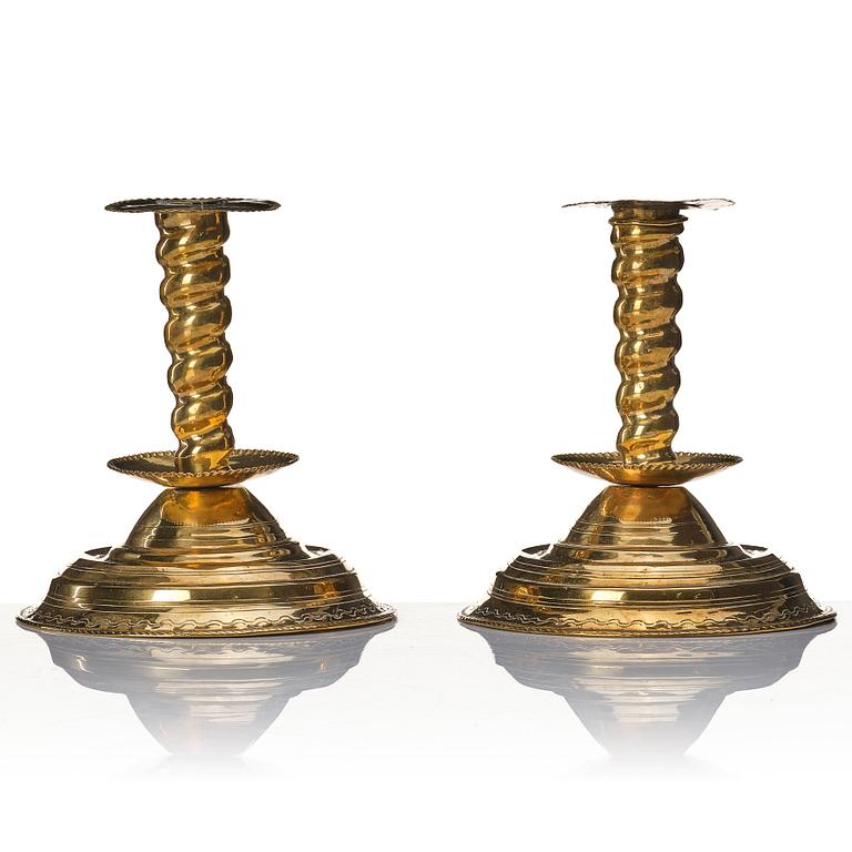 A pair of late Baroque candlesticks.