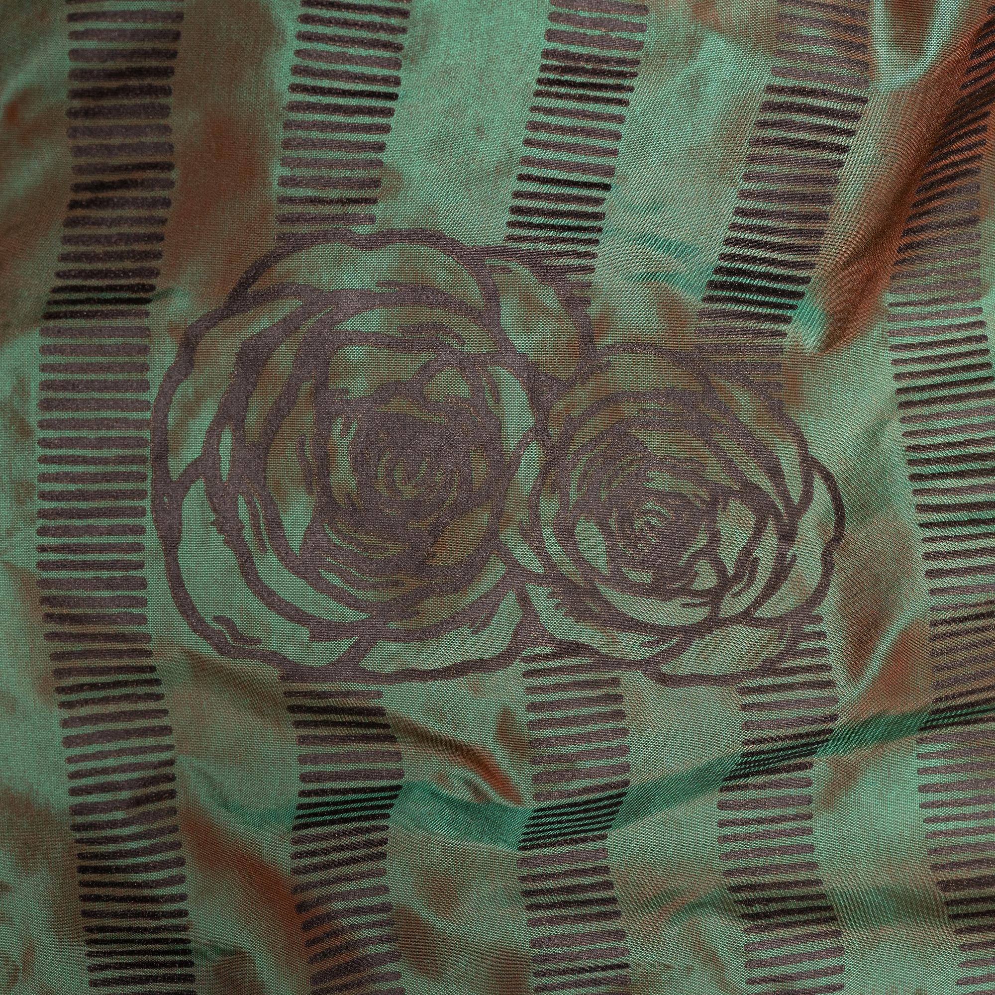 A set of four green silk curtains.