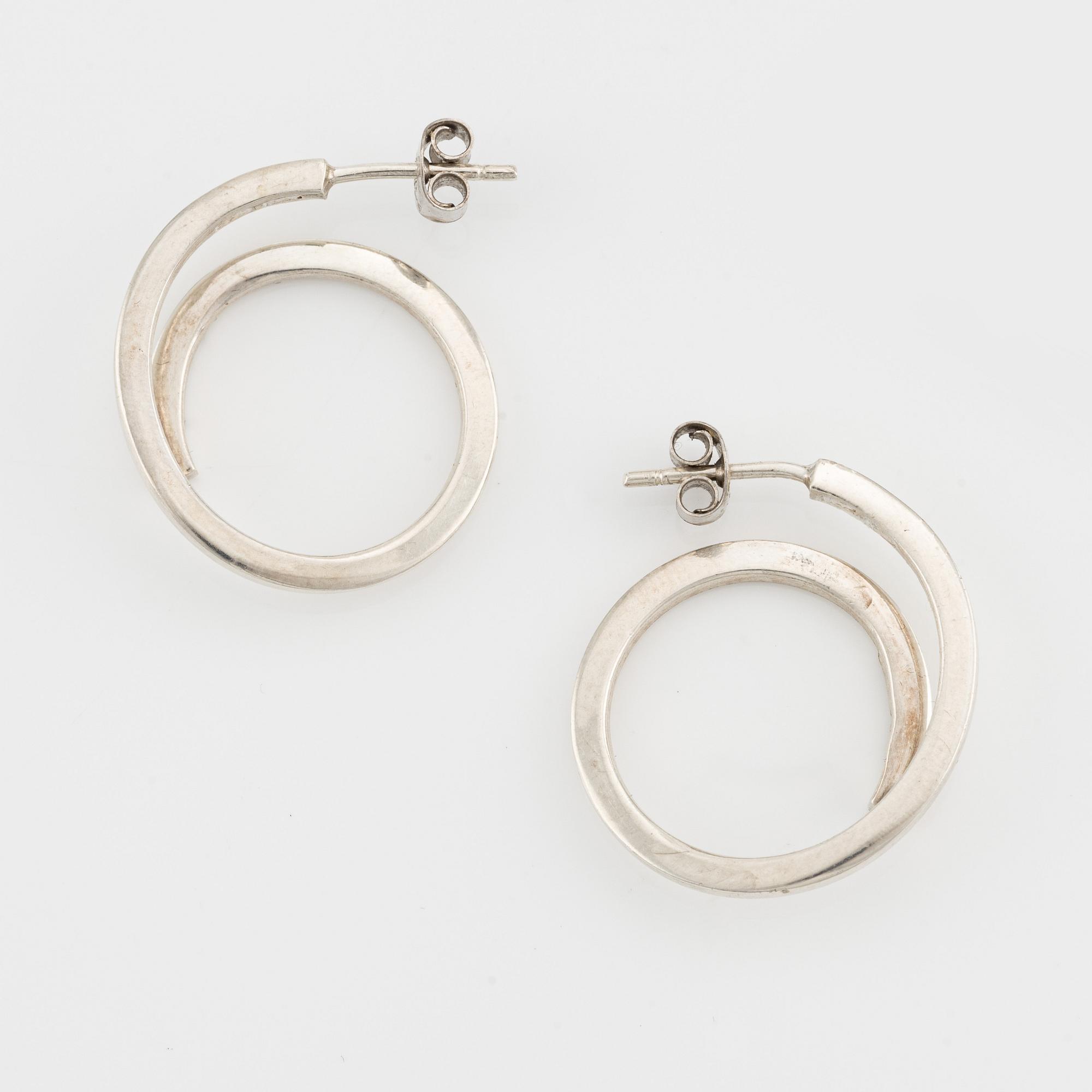 Efva Attling three pair of silver earrings.