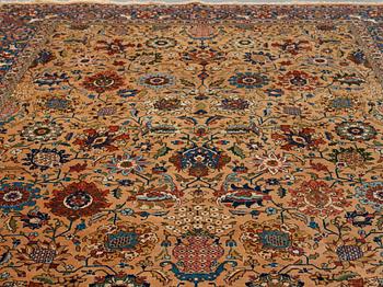 A carpet, semi-antique Tabriz, ca 404 x 292 cm.