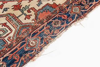An antique Heriz carpet, ca 350 x 317 cm.
