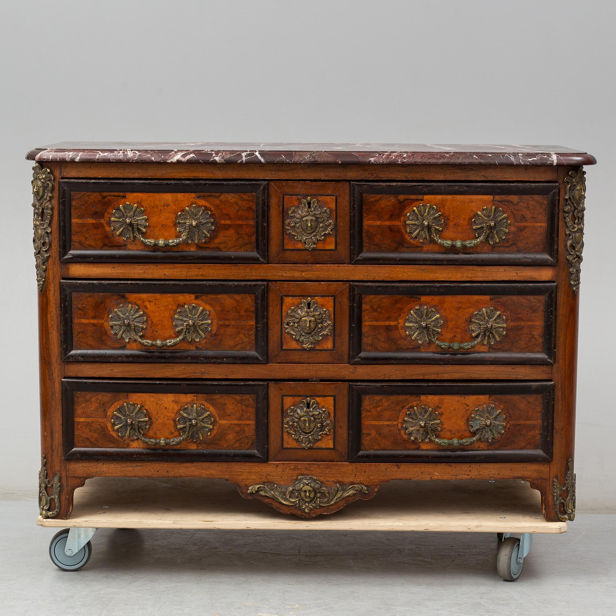 A 20th century French Regence style commode.