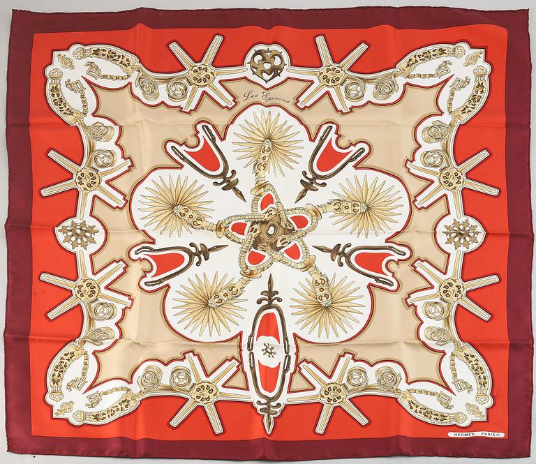 Hermès, a 'Les Eperons' silk scarf.