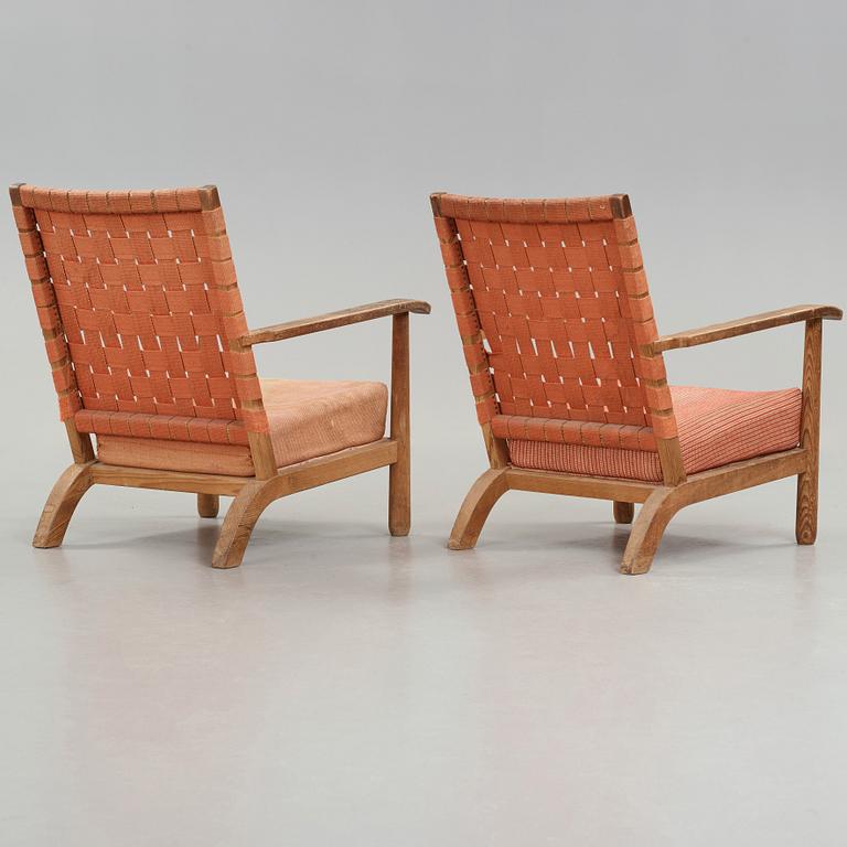 Axel Einar Hjorth, a pair of pine easy chairs, probably model 'Väddö' by Nordiska Kompaniet, Sweden 1930's.