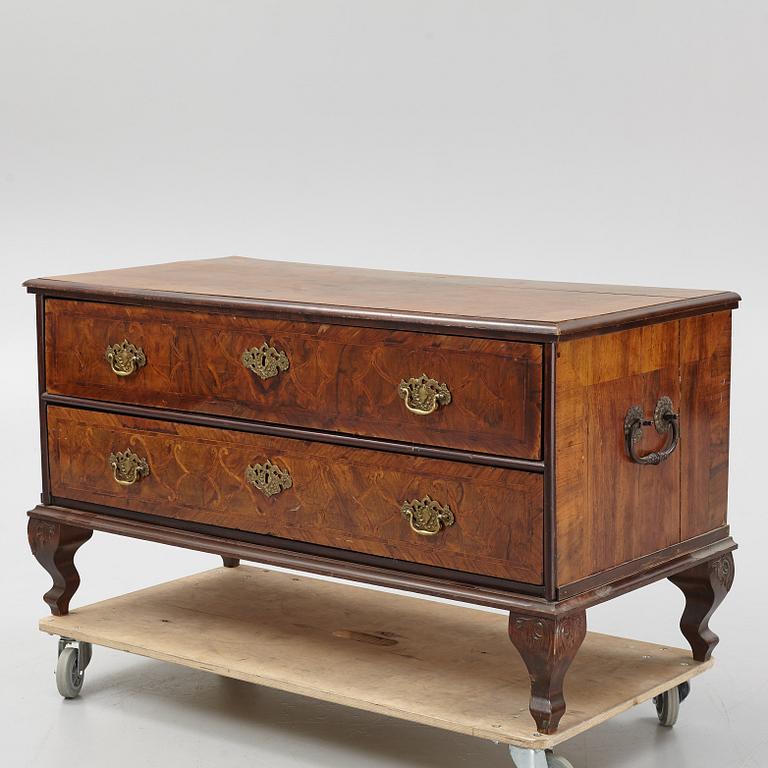 A 18th century baroque chest of drawers.