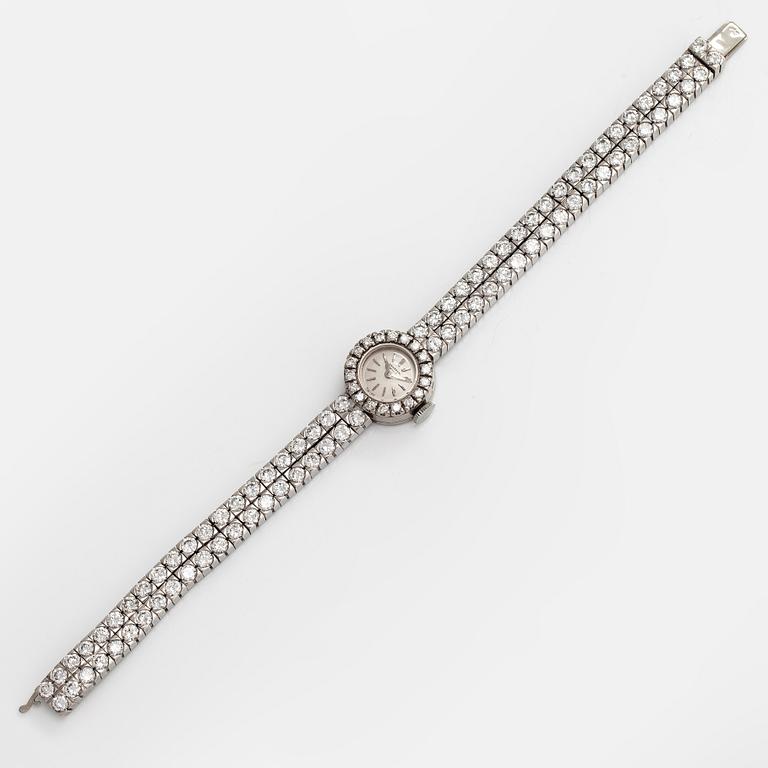 A platinum/18K white gold wristwatch, with brilliant and 16/16 cut diamonds totalling approximately 7.10 ct.