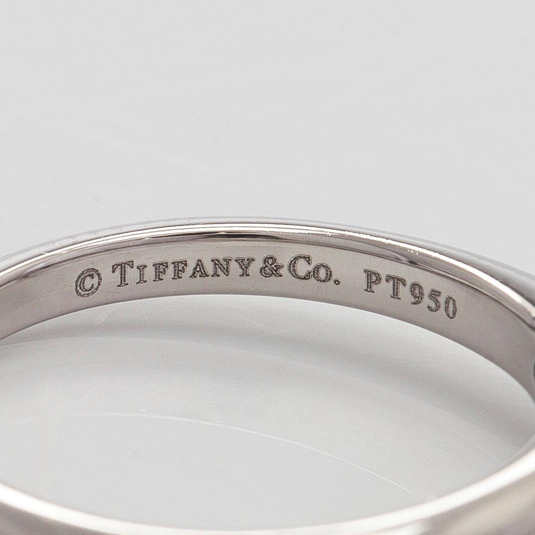 Tiffany & Co, a platinum solitaire ring with a brilliant-cut diamond.