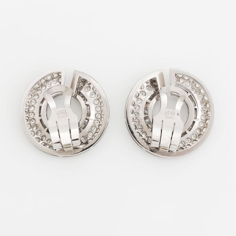 A pair of 14K gold earrings set with round brilliant- and baguette-cut diamonds.