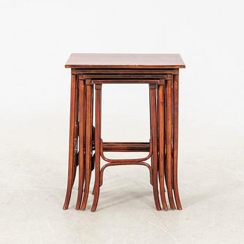 An early 19th century nest of four tables in stained beech from Thonet.