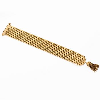 Armband 18K guld med tofs, 1900-talets andra hälft.