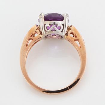 Oval faceted amethyst and brilliant-cut diamond ring.
