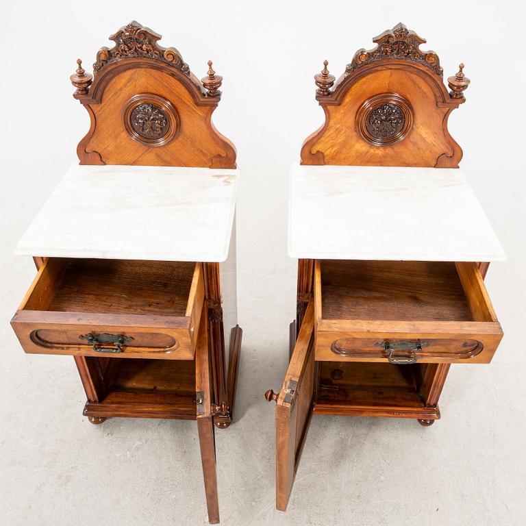 A pair of lacquered walnut and marble bedside tables from the first half of the 20th cenutry.