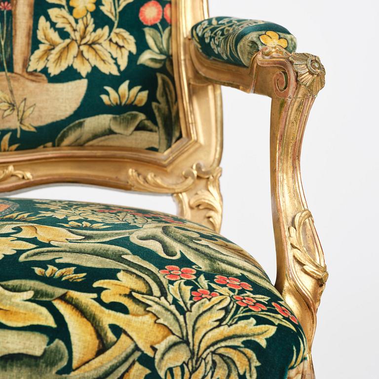 A pair of Louis XV-style giltwood fauteuils, late 19th century.