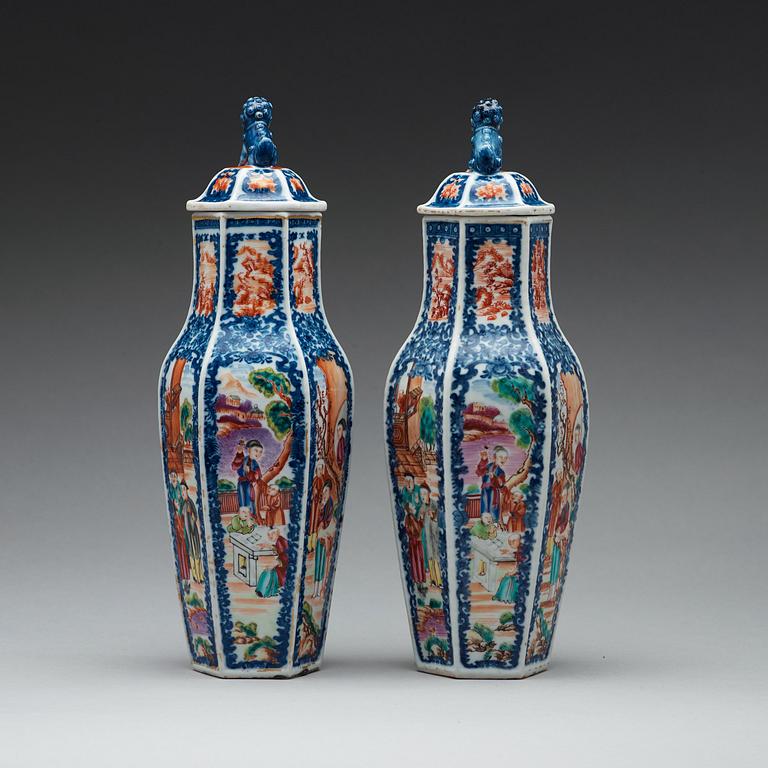 A pair of famille rose and underglaze blue vases with covers, Qing dynasty, Qianlong (1736-95).