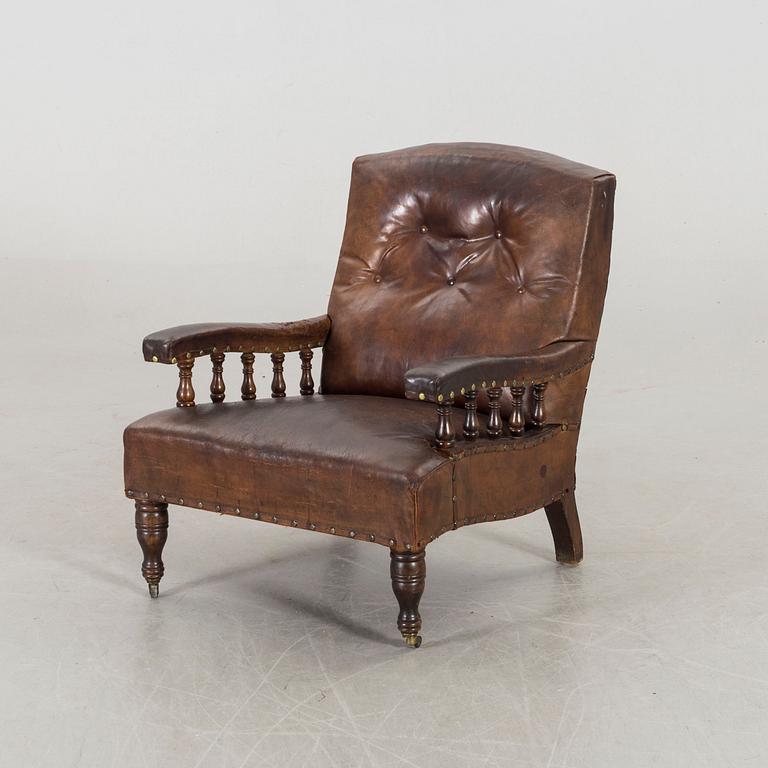 A LEATHER ARMCHAIR early 20th century.