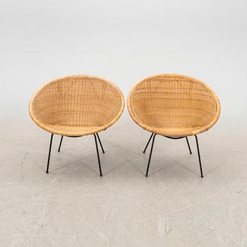 A pair of rattan 1950s easy chairs.