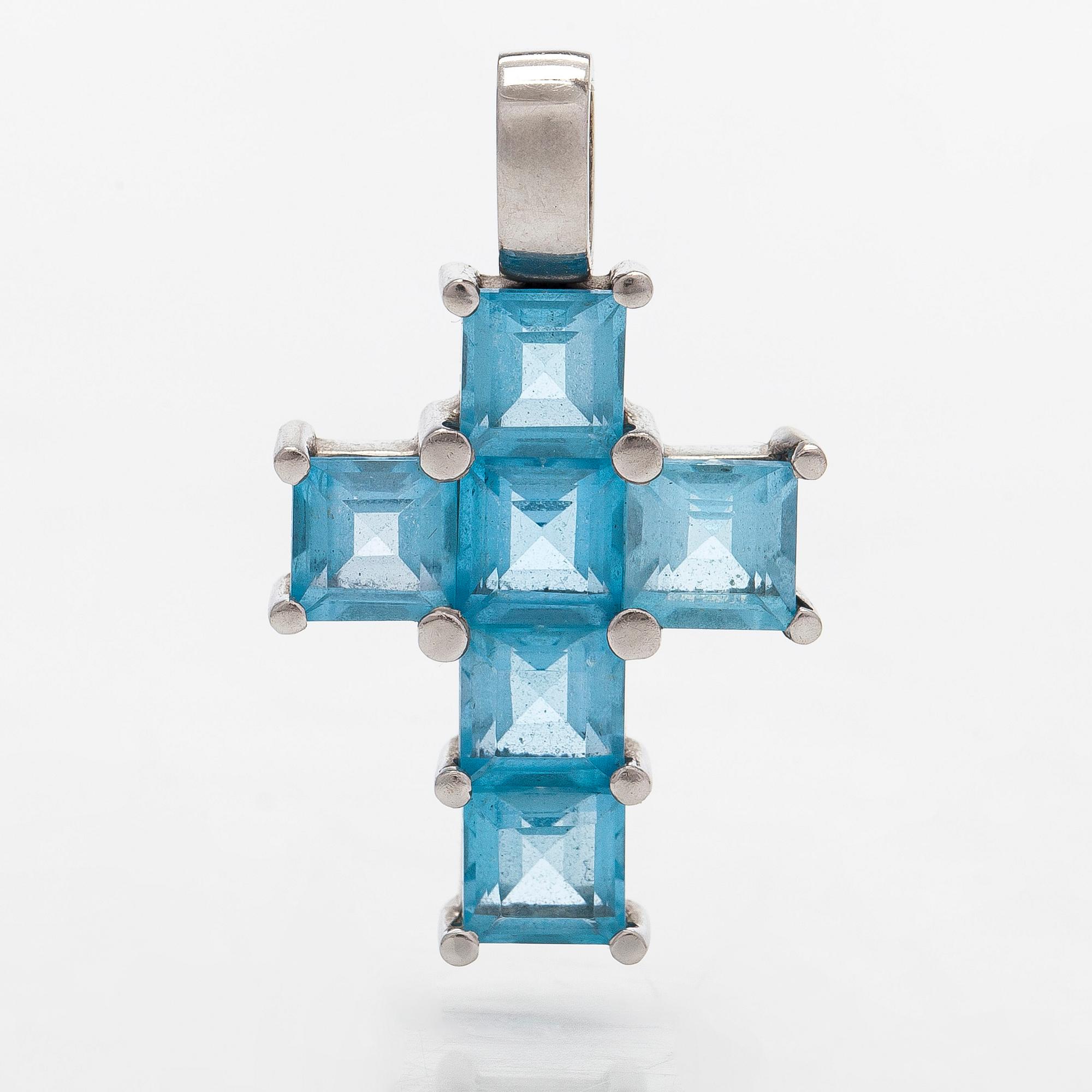 Hänge i form av kors, 14K vitguld med topaser.