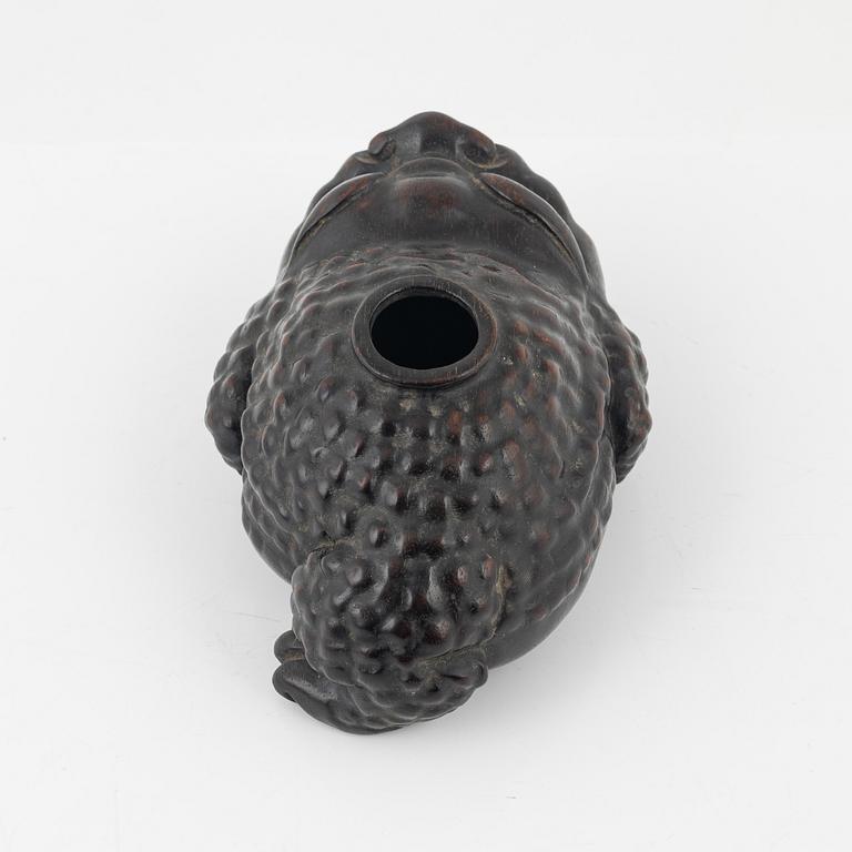 A wooden brushpot in the shape of a three legged toad, China, 20th Century.