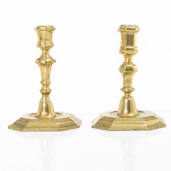 A set of two Northern European late baroque brass candlesticks, first part 18th century.
