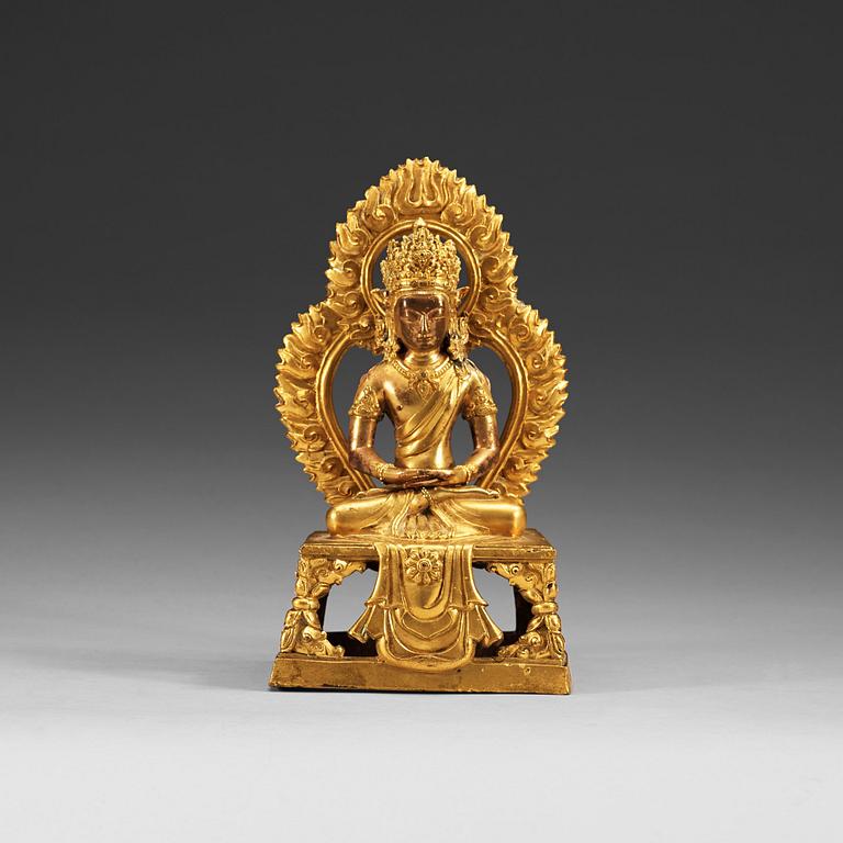 A gilt bronze figure of Bodhisattva, Qing dynasty, 18th Century. With inscription to base.