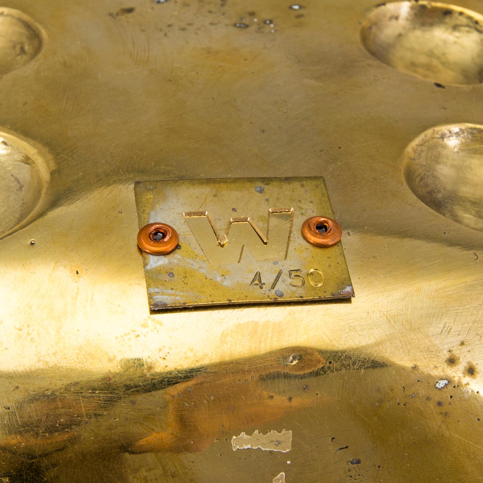 A brass sculpture by Andreas Wargenbrant, signed and numbered 4/50.