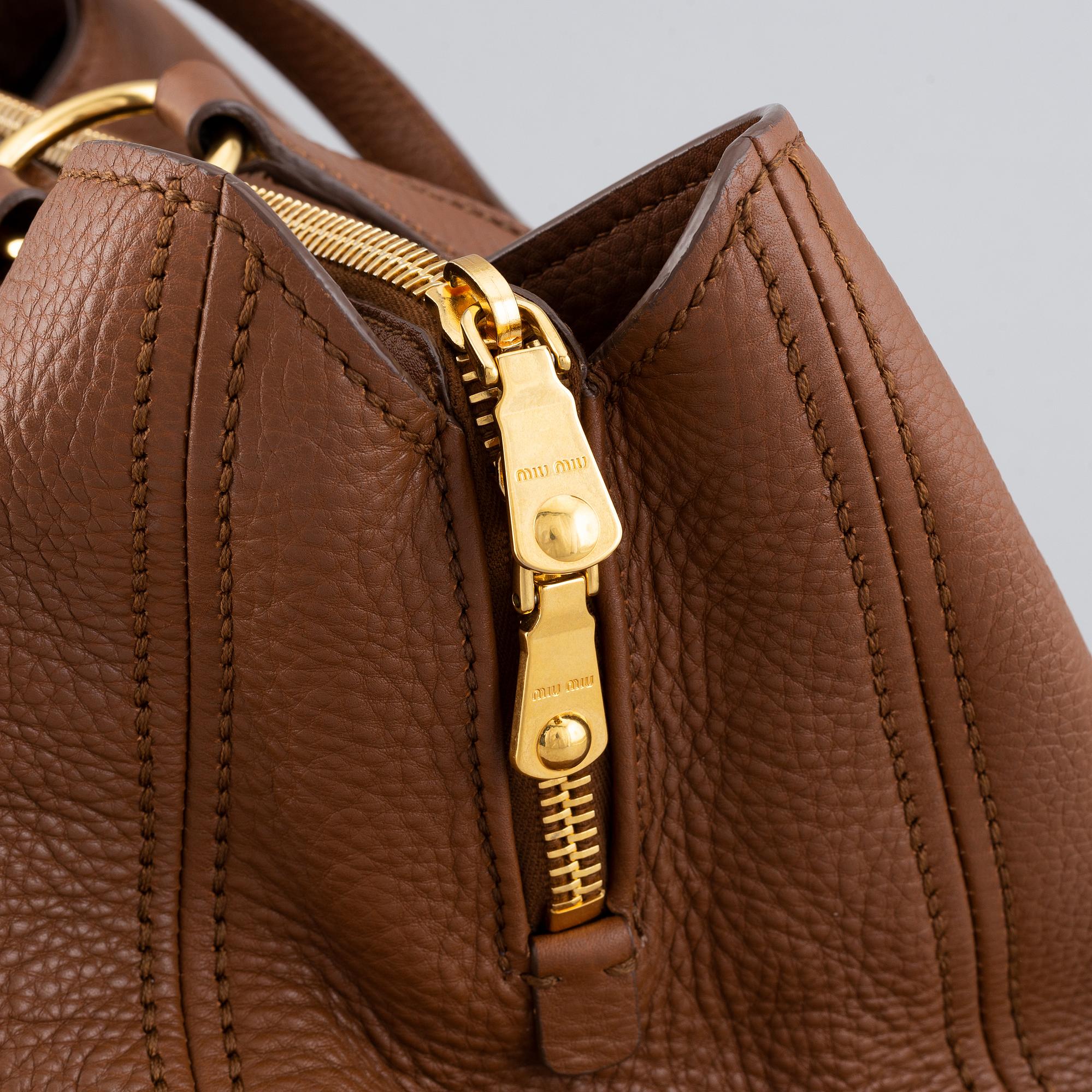 Miu Miu, a leather bag.