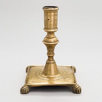 A late 17th century Spanish brass candlestick.