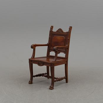 An end of the 20th century oak arm chair.