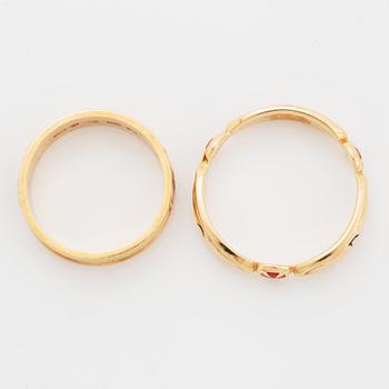 Two rings, 18K gold and enamel.