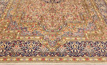 A Kirman Laver carpet, 'Millefleur', approx. 410 x 296 cm.