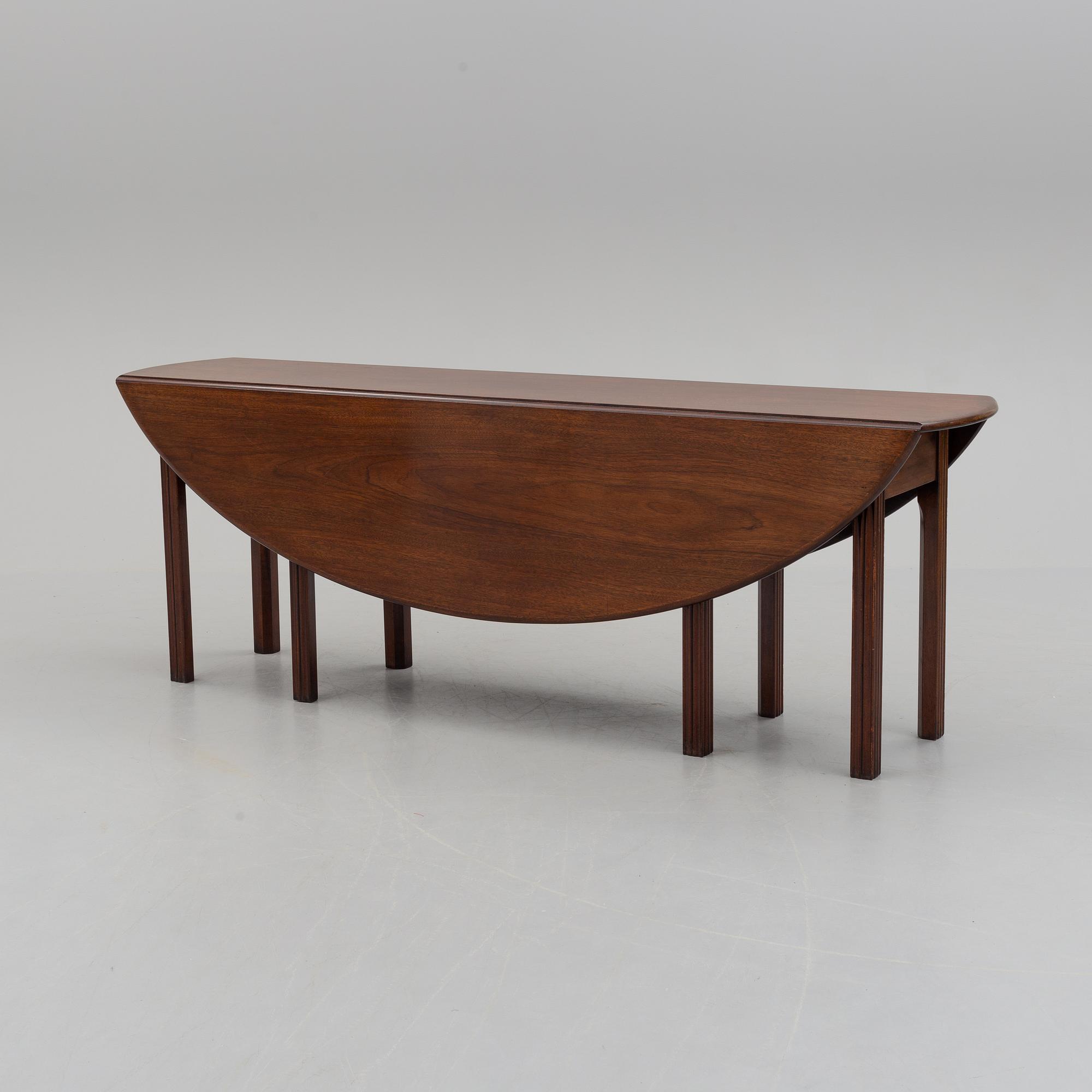 A DINING TABLE, England, made for NK, Nordiska Kompaniet, Sweden. Signed with label. Probably 1960s / 70s.