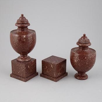 A pair of porphyry urns, presumably first half 20th century.