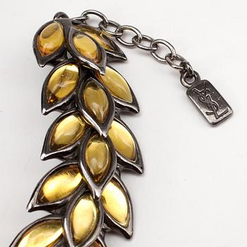 YVES SAINT LAURENT, a metal and glass necklace.
