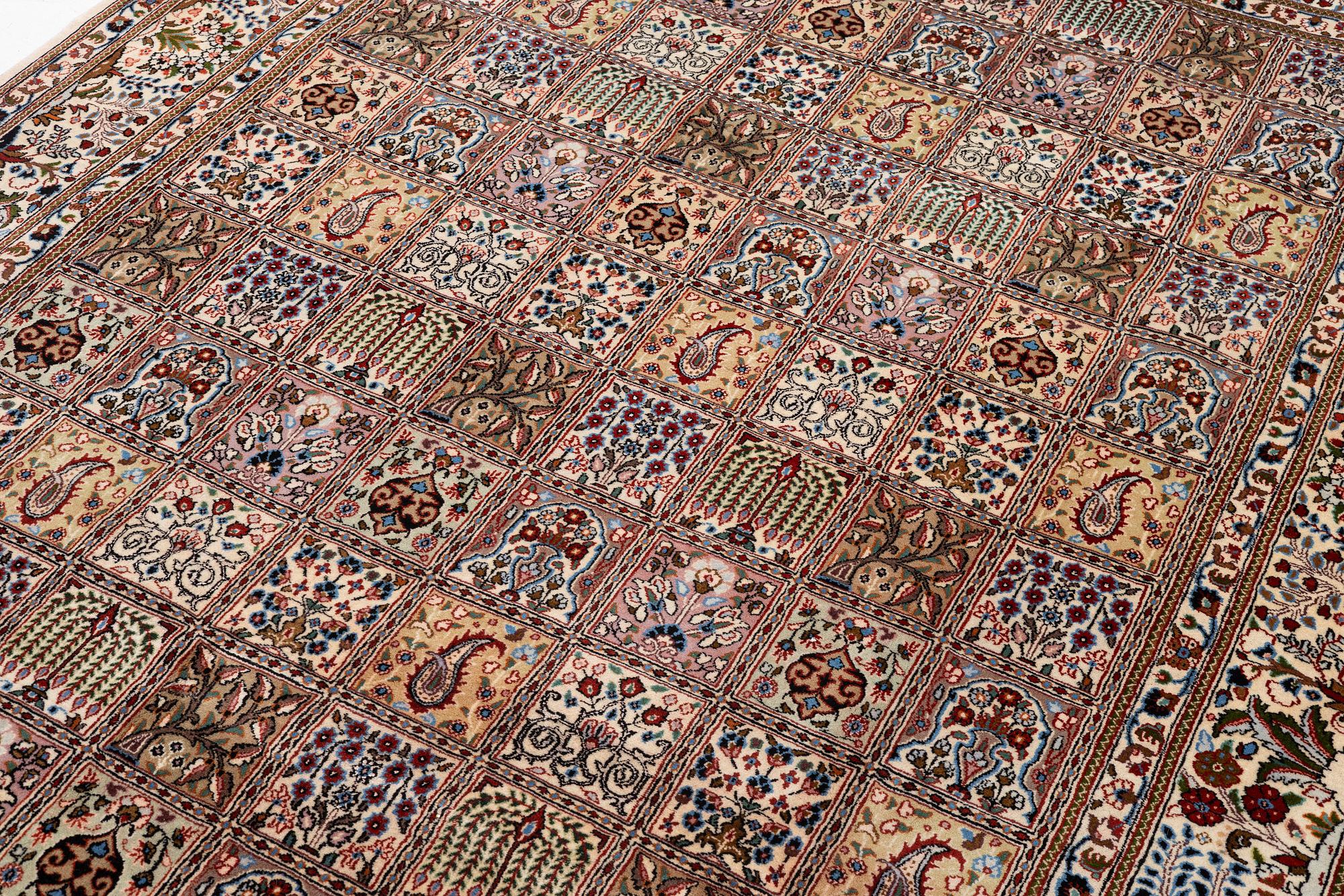 A Moud carpet, part silk, approx. 285 x 195 cm.