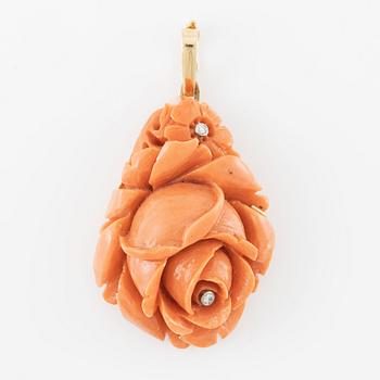 Pendant, 18K gold with carved coral and small diamonds, in the shape of a flower.