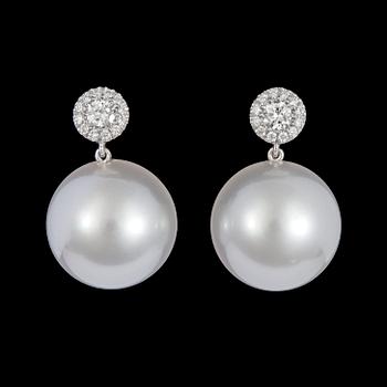 A pair of cultured South sea pearl, 14 mm, and brilliant dut diamond earrings, tot. 0.42 cts.