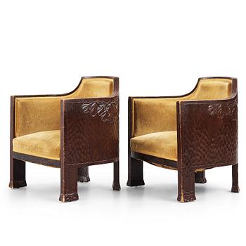 276. Otto Wretling, attributed to, a pair of Art Nouveau carved pine easy chairs,