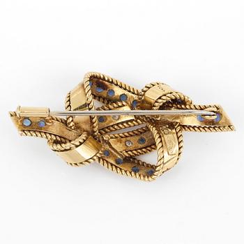 BROSCH, med briljantslipade diamanter, ca 0,24 ct och troligen fasetterade safirer.