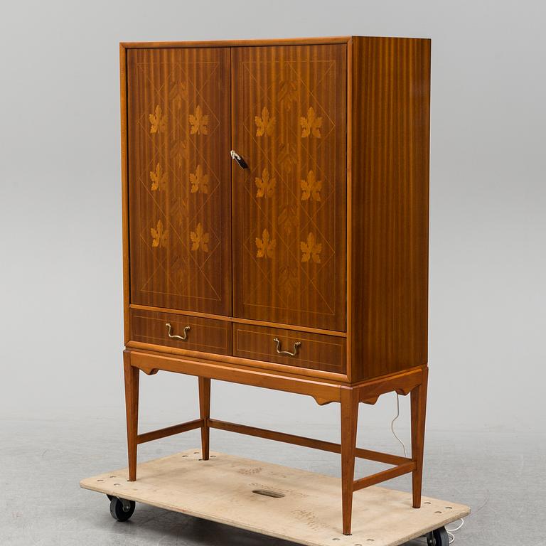 A mid 20th Century bar cabinet.