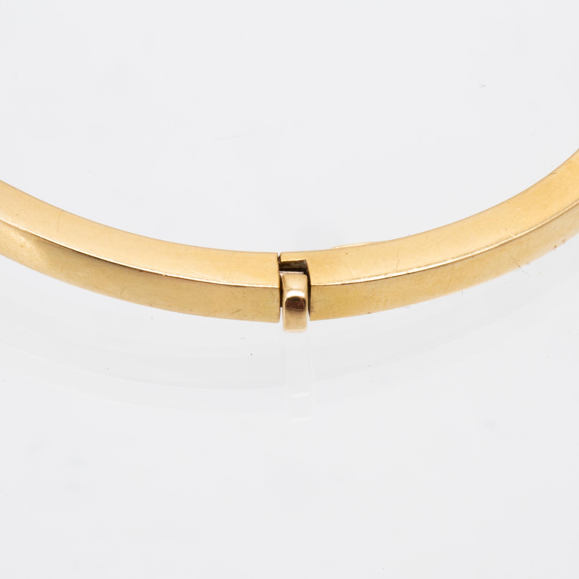 An 18K gold bracelet.