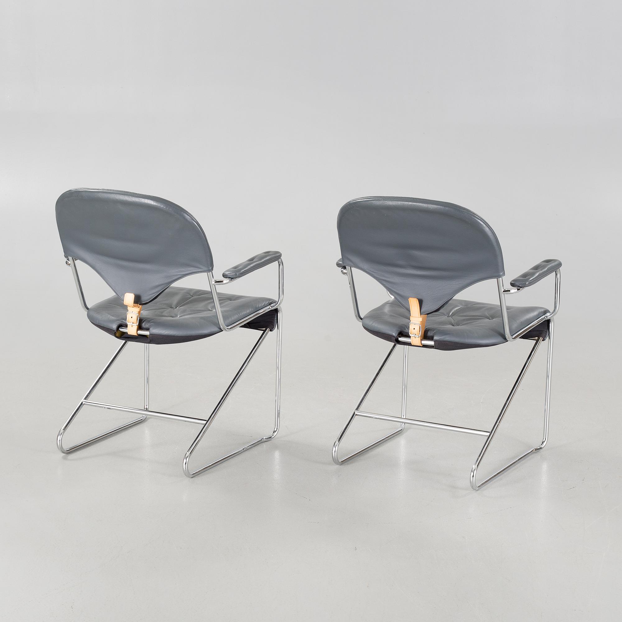 A pair of chairs by Sam Larsson for Dux, designed in 1974.